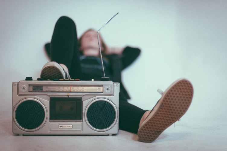 Woman lying with radio